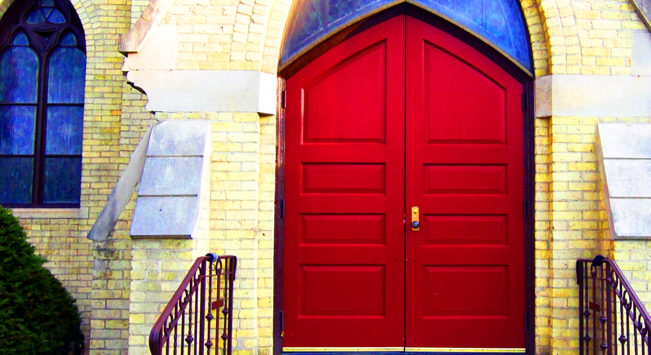 A picture of the front door of the church.